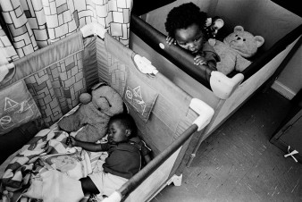 SOUTH AFRICA Khayelitsha Township, Cape Town HIV positive children in cots go to bed after lunch at ‘Lizo Nobanda’ day care centre. Here children orphaned after the deaths of their parents from AIDS learn how to read and write, play together and eventually accept their HIV positive status.